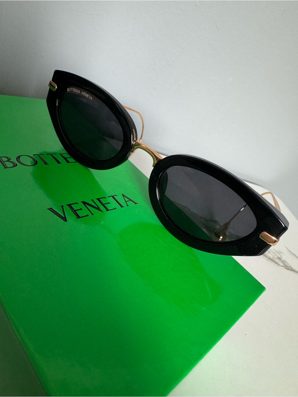 Bottega Veneta Black and Gold Cat-Eye Sunglasses with Eardrops design
